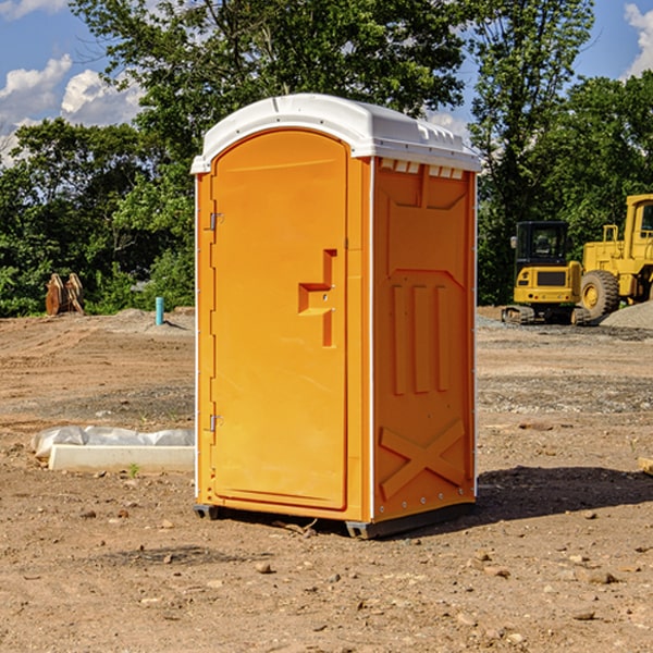 what is the cost difference between standard and deluxe portable restroom rentals in Harris